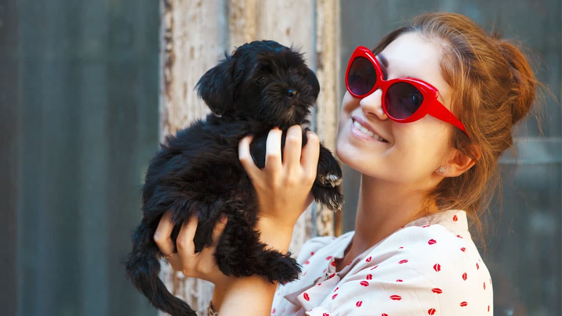 A girl and her cute dog on pawternity leave