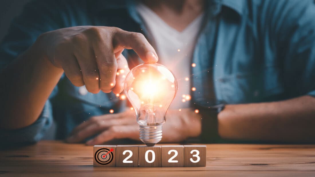 An HR leader touching a lightbulb in 2023.