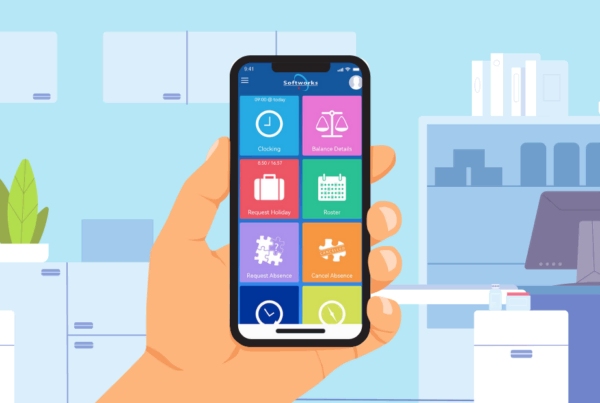 A person in an office holding a phone with Softworks Employee Self-service App